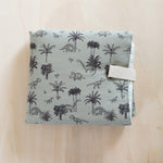 Matelas à langer de voyage T-Rex - Milinane